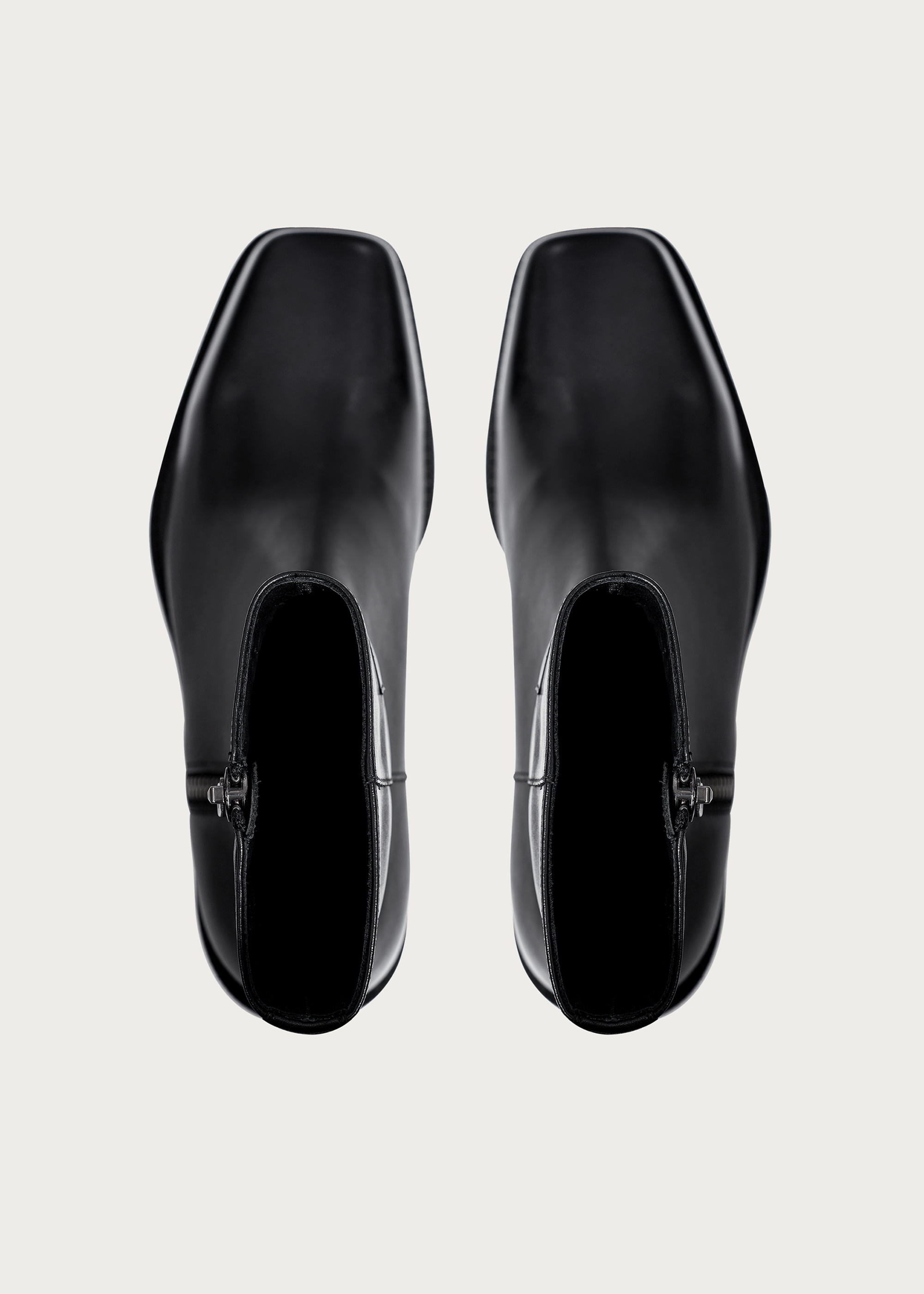 Square-toe black ankle boots side profile