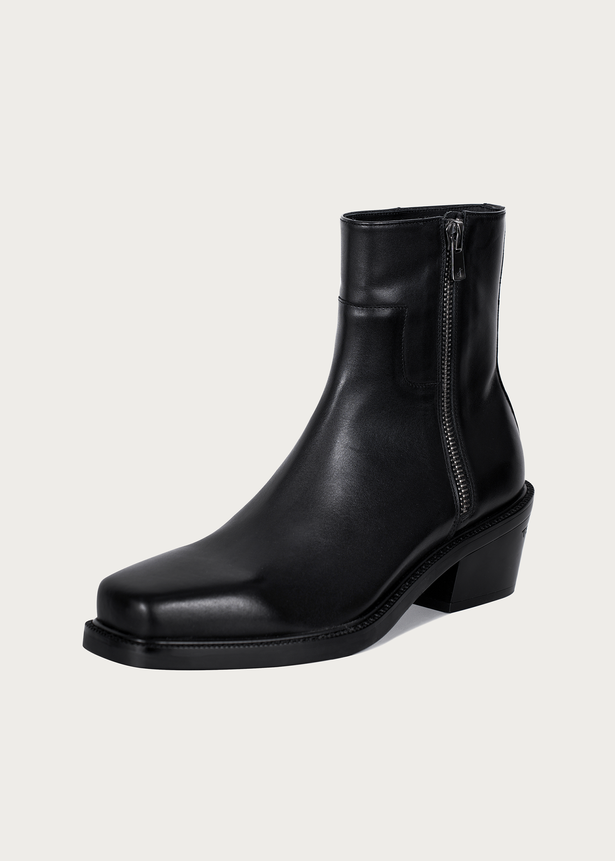 Black square-toe ankle boots heel detail
